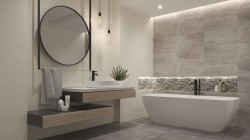 Elegantná kúpeľňa s voľne stojacou vaňou, mozaikovým pruhom na stene, veľkým okrúhlym zrkadlom a závesným umývadlom v kombinácii drevodekor a šedé obklady