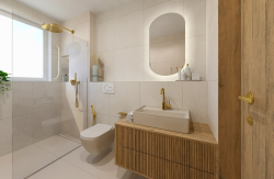 Svetlá kúpeľňa s béžovým obkladom, zlatými batériami, drevenou skrinkou s doskovým umývadlom a sprchou pri okne