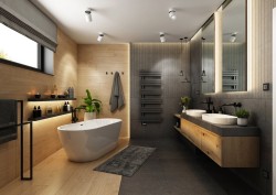 Luxusná veľká kúpeľňa s voľne stojacou vaňou, dvojicou miskových umývadiel na dlhej doske, obklady v drevodekore a tmavou stenou s dizajnovým radiátorom