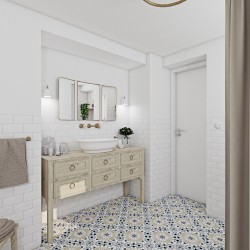 Retro umývadlová zóna so svetlou drevenou skrinkou, umývadlom, zlatou nástennou batériou a vzorovanou dlažbou v jemných tónoch