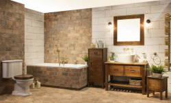 Kúpeľňa v rustikálnom štýle so vstavanou vaňou, dreveným nábytkom, umývadlom na doske a obklady v tehlovom dekore